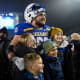 SDSU's offensive lineman Mason McCormick poses with a group after the FCS semifinals against UAlbany on Friday, Dec. 15, 2023 at Dana J. Dykhouse in Brookings.
